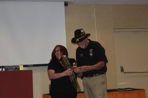 Tiffany Hoffmann receiving her Figurine from Gordon Jones.